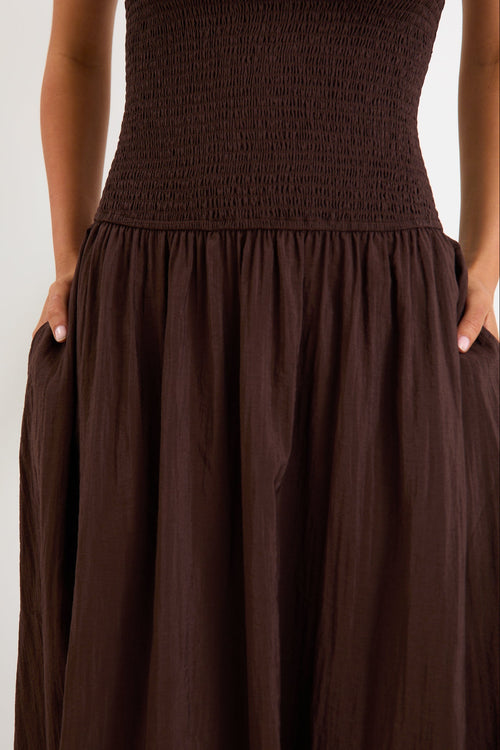 Woman wearing a brown dress