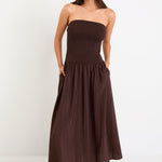 Woman wearing a brown dress