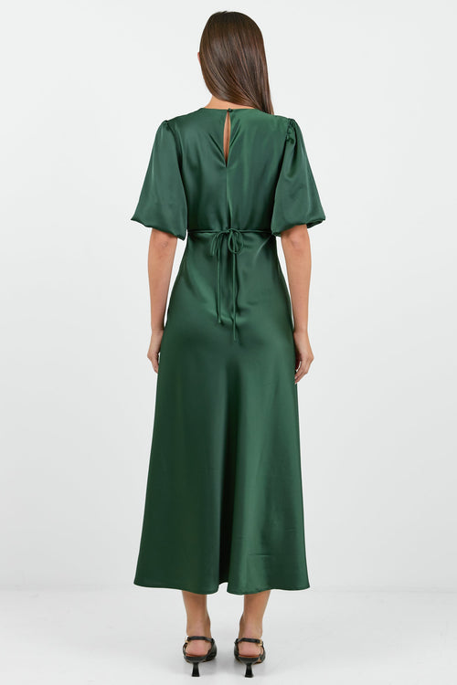 Woman wearing a green dress on a white background