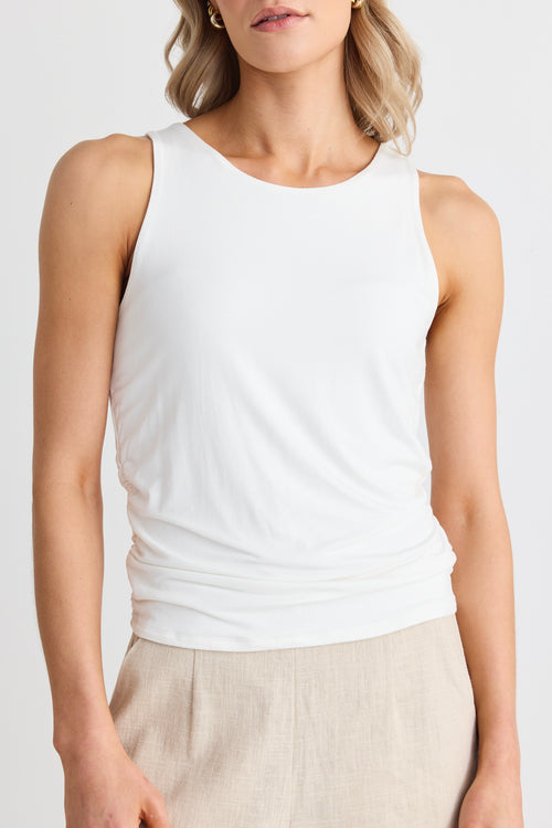 model wears a white tank