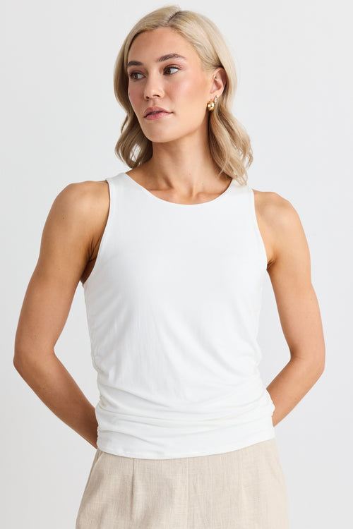 model wears a white tank