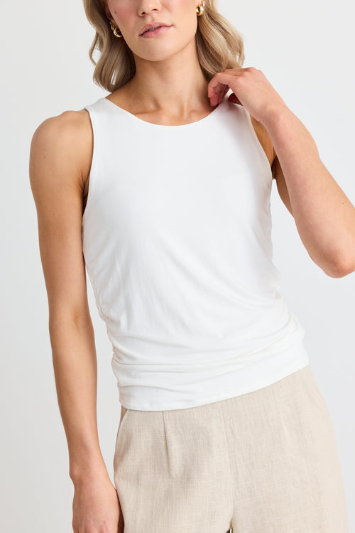 model wears a white tank