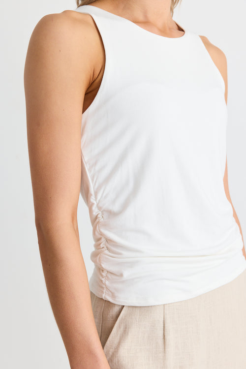 model wears a white tank