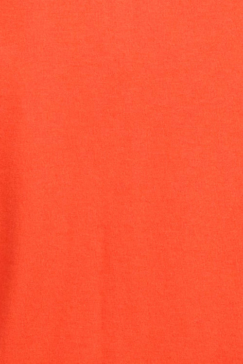 Close up of orange knit fabric