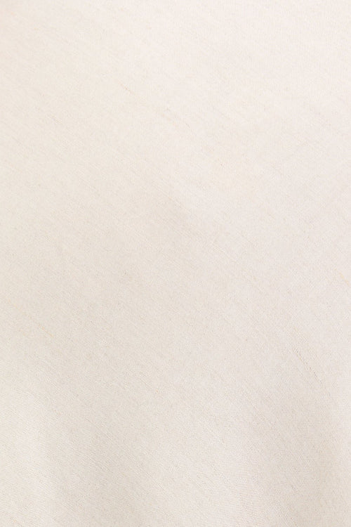 Beige dress with thin straps on a white background