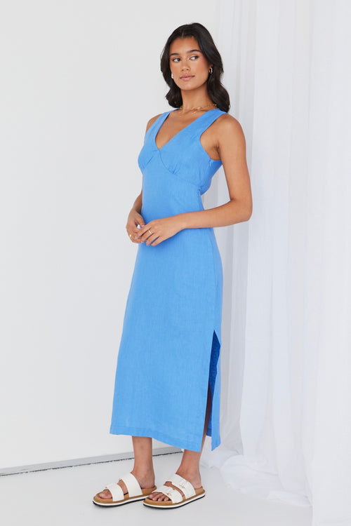 Model wears a linen maxi blue dress. 