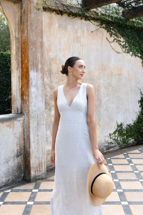 model wears linen v neck midi dress