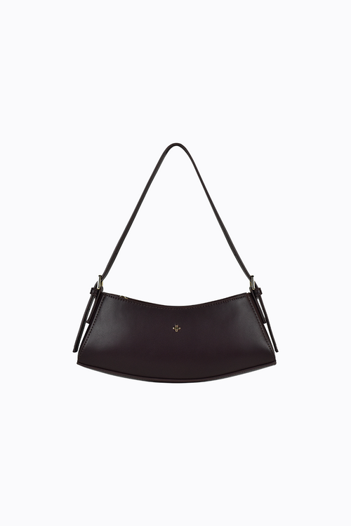 Black handbag with a strap on a white background