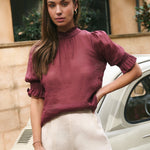 Model wears Burgundy top