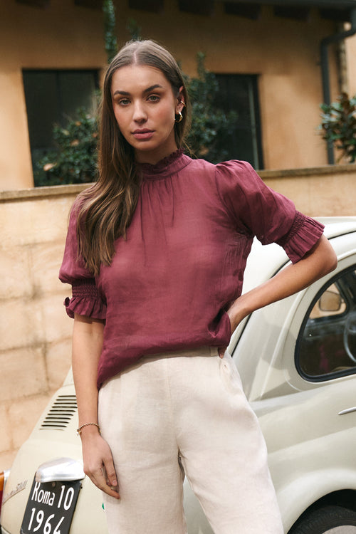 Model wears Burgundy top
