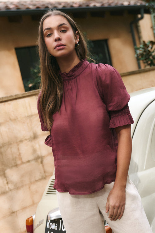 Model wears Burgundy top