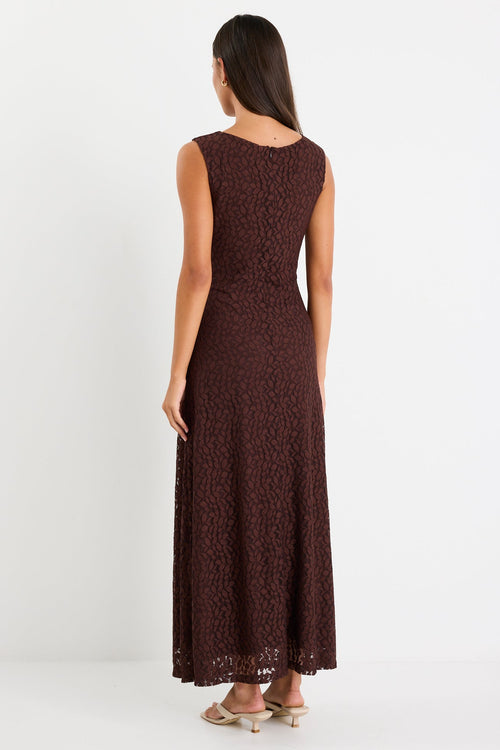 Woman wearing a brown lace maxi dress