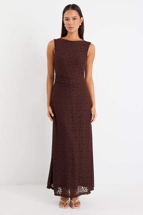 Woman wearing a brown lace maxi dress