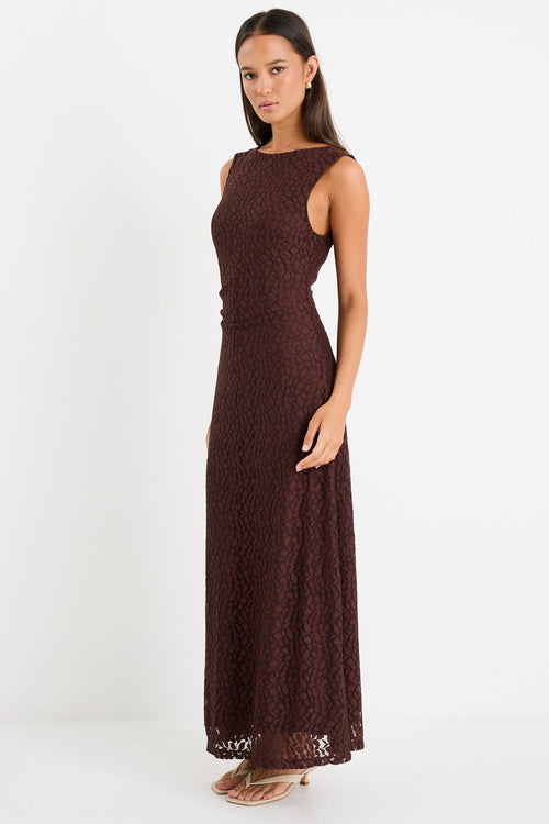 Woman wearing a brown lace maxi dress