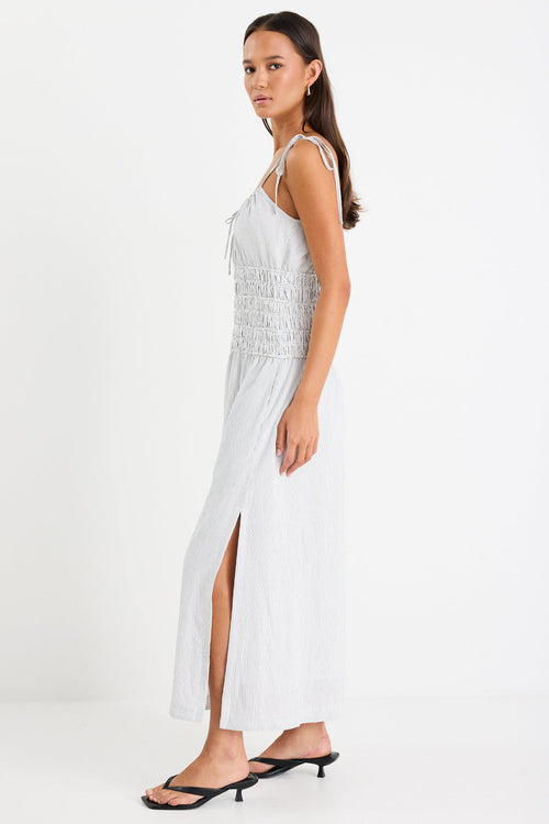 Woman wearing a black and white midi dress