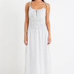 Woman wearing a black and white midi dress