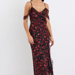 Woman wearing a floral dress on a white background