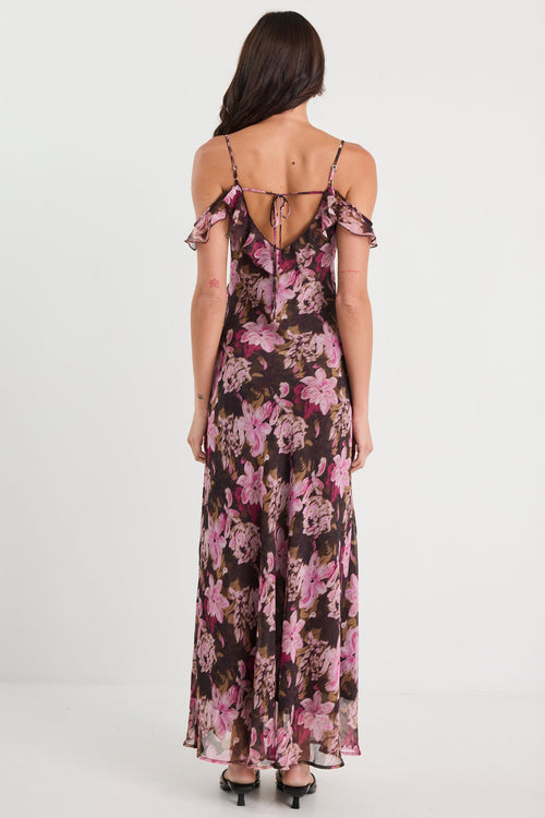 Woman wearing a floral dress on a white background