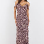 Woman wearing a floral dress on a white background