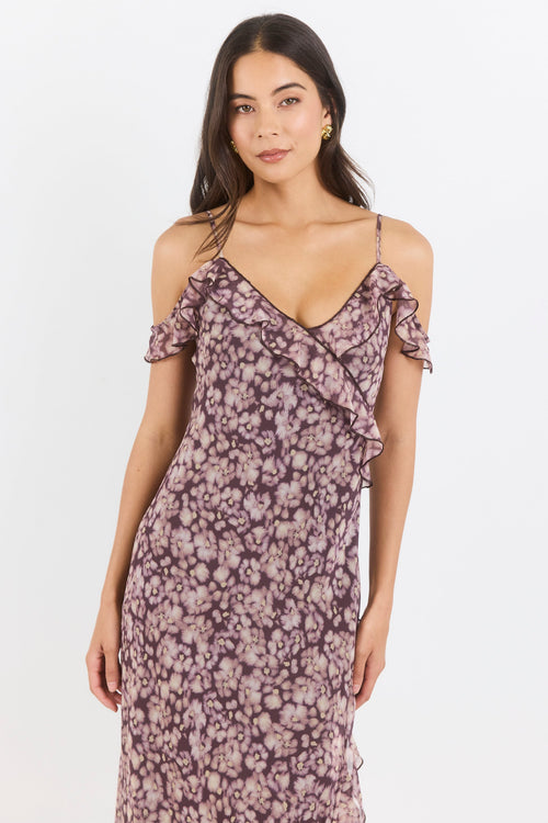 Woman wearing a floral dress on a white background