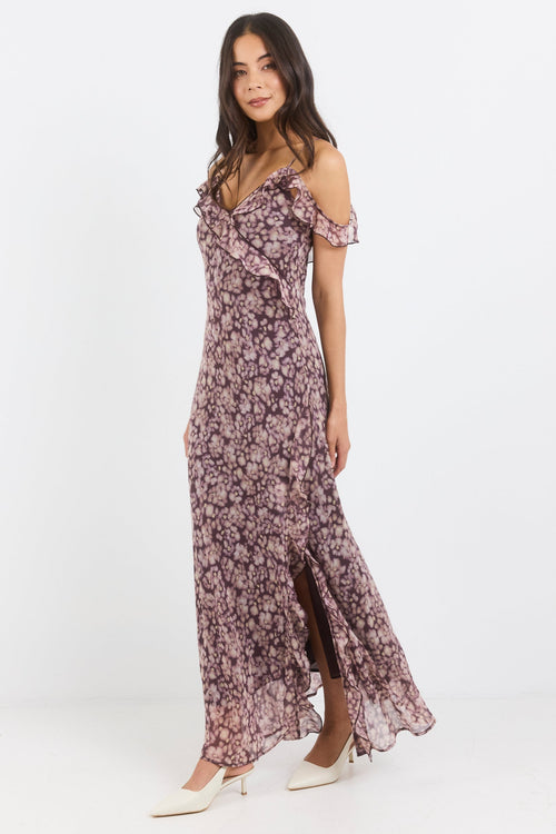 Woman wearing a floral dress on a white background