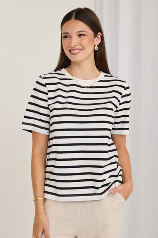 model wears a black and white stripe tee