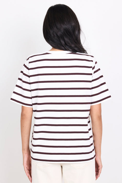 Person wearing a black and white striped shirt on a white background