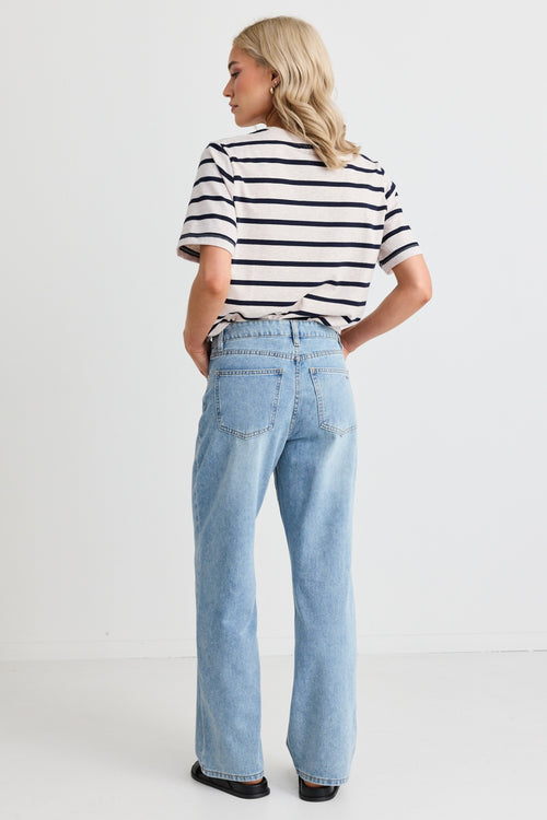 model wears blue jeans