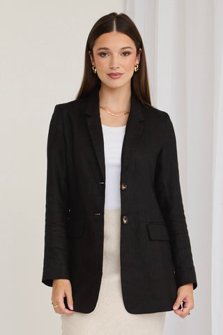 model wears a black blazer
