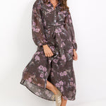 Woman wearing a floral dress on a white background