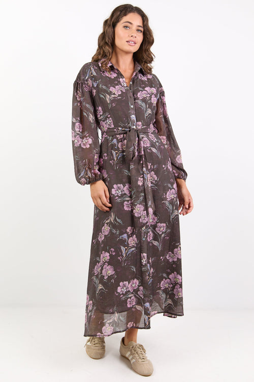 Woman wearing a floral dress on a white background