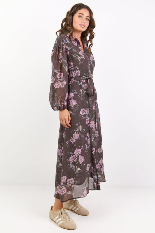 Woman wearing a floral dress on a white background