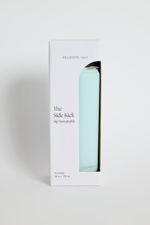 Packaging of 'The Sidekick' drink bottle by REUNION label on a white background
