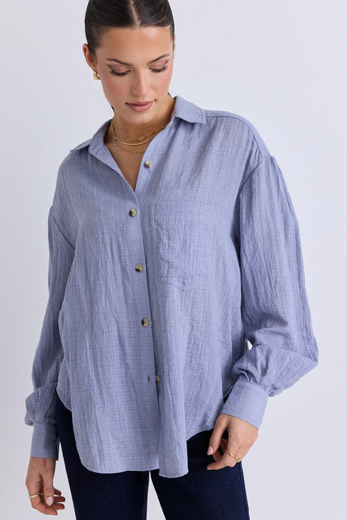 model wears a blue shirt