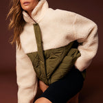 model wears a cream green jacket