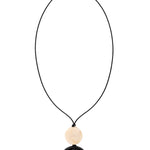 A black cord necklace featuring a round beige wooden bead and a larger brown circular pendant with a cutout, shown against a plain white background.