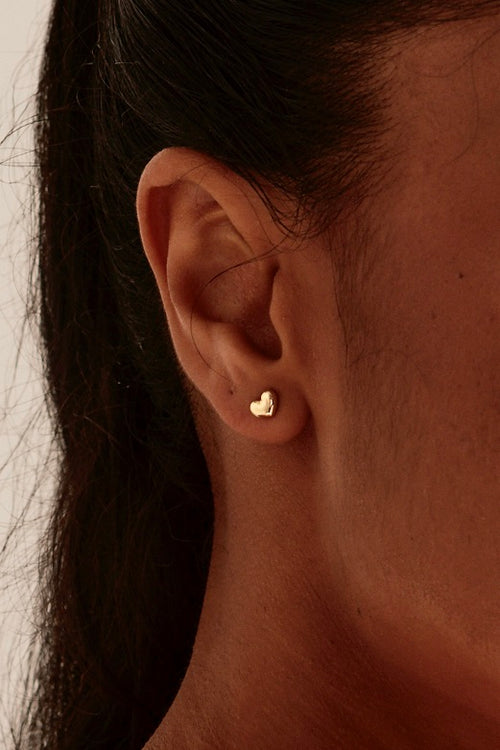 model wearing Bubble Heart Stud Gold Earrings