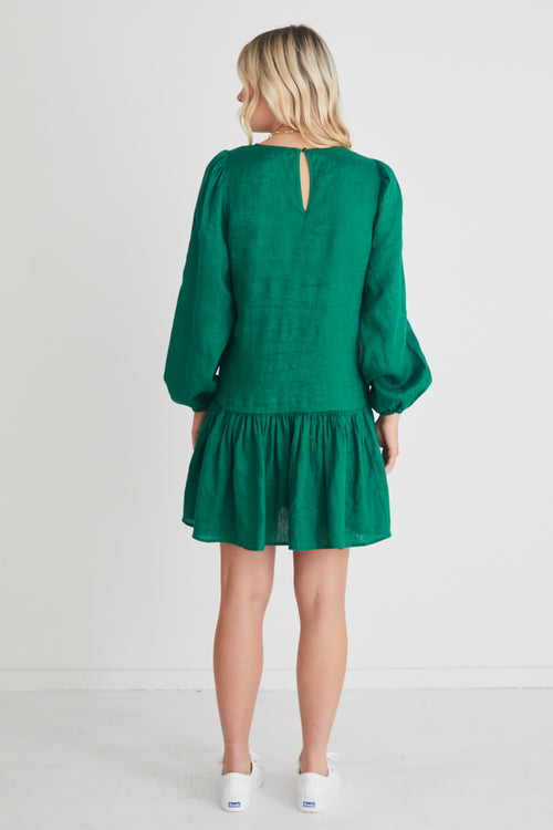 Model wears a green long sleeve mini dress