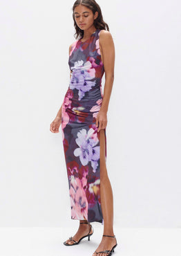 model wears a purple print maxi dress