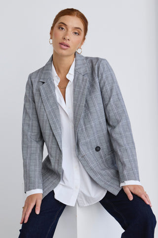 model wears a grey blazer