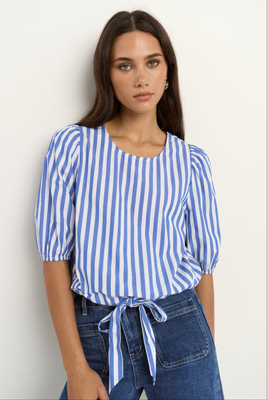 woman wearing a blue white stripe top and blue jeans