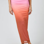 model wears a pink mesh maxi skirt