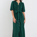 Woman wearing a green dress on a white background