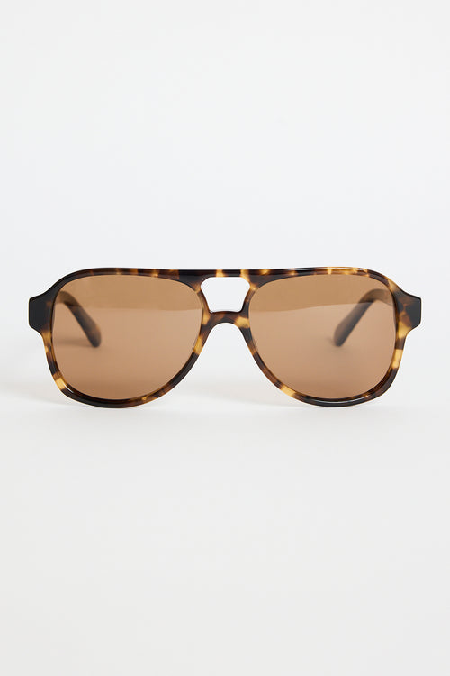Tortoiseshell aviator sunglasses with warm brown tinted lenses, photographed on a white background.