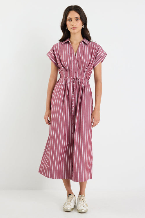 Woman wearing a striped dress on a white background