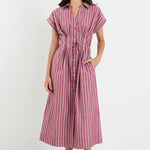 Woman wearing a striped dress on a white background