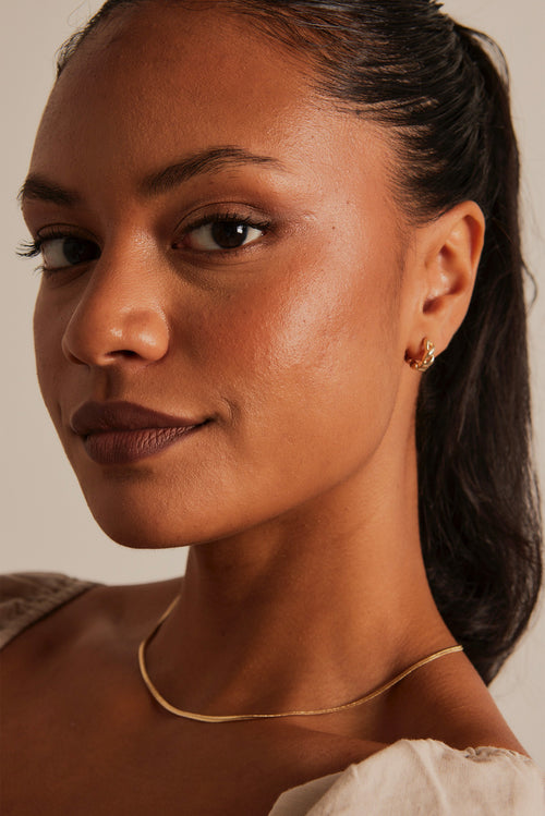 model wearing Chain Hoop Gold Earrings