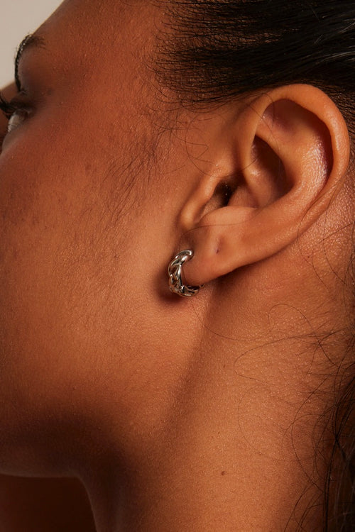 model wearing Chain Hoop Rhodium Earrings