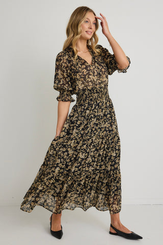 model wears a Black Gold Floral Midi Dress