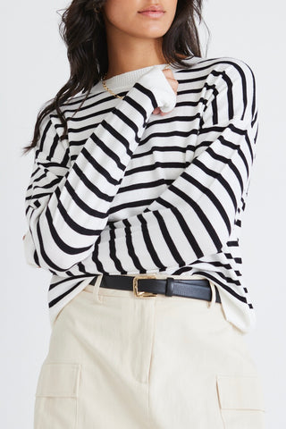 model wears a white stripe knit